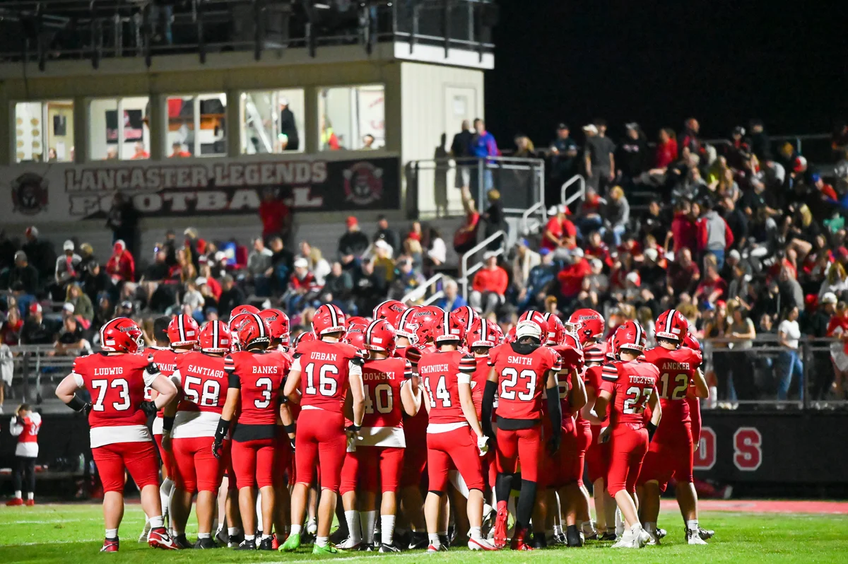Lancaster Legends huddle on the field